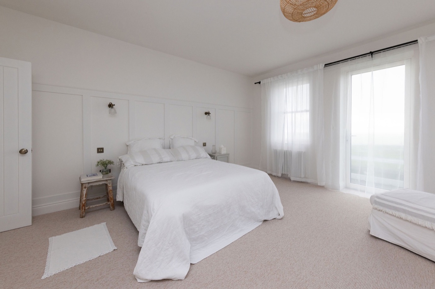Sea-facing bedroom with sheer curtains at The Lookout Brighton